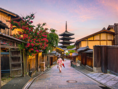 Japanese girl in Yukata with red umbrella in old town  Kyoto, Japan