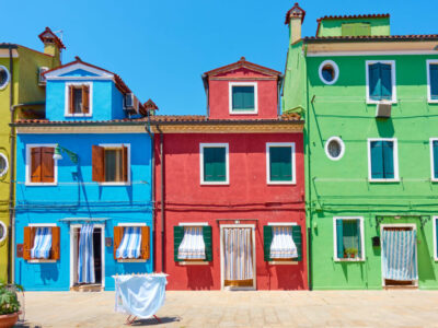Street with colorful old houses in Burano island in Venice, Italy  -- Italian cityscape
