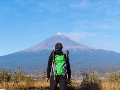 A viewpoint of a hiker with a backpack in nature