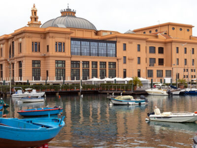 Margherita Theater and fishing boats in old harbor of Bari, Pugl