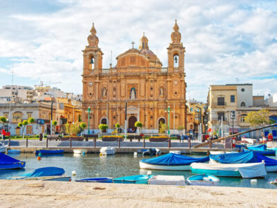 Parish Church at Msida marina with boats on Malta Island. People on the background