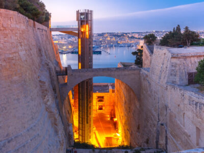 Upper Barrakka Lift, from Grand Harbour to Upper Barrakka Gardens, during morning blue hour, Valletta, Malta
