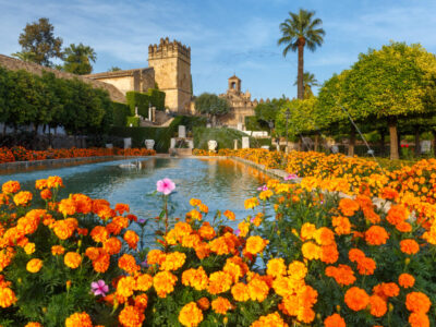 Blooming gardens and fountains of Alcazar de los Reyes Cristianos, royal palace of the cristian kings, in Cordoba, Andalusia, Spain