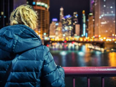 Woman and the City Lights. Modern Illuminated City Vista From the Bridge.